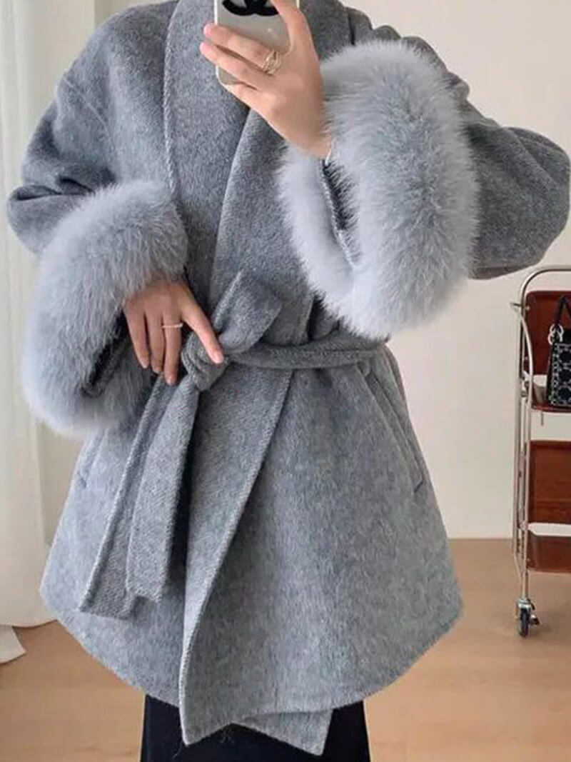 Elegant women's outerwear: a versatile belted wrap coat with cozy faux fur cuffs for winter.