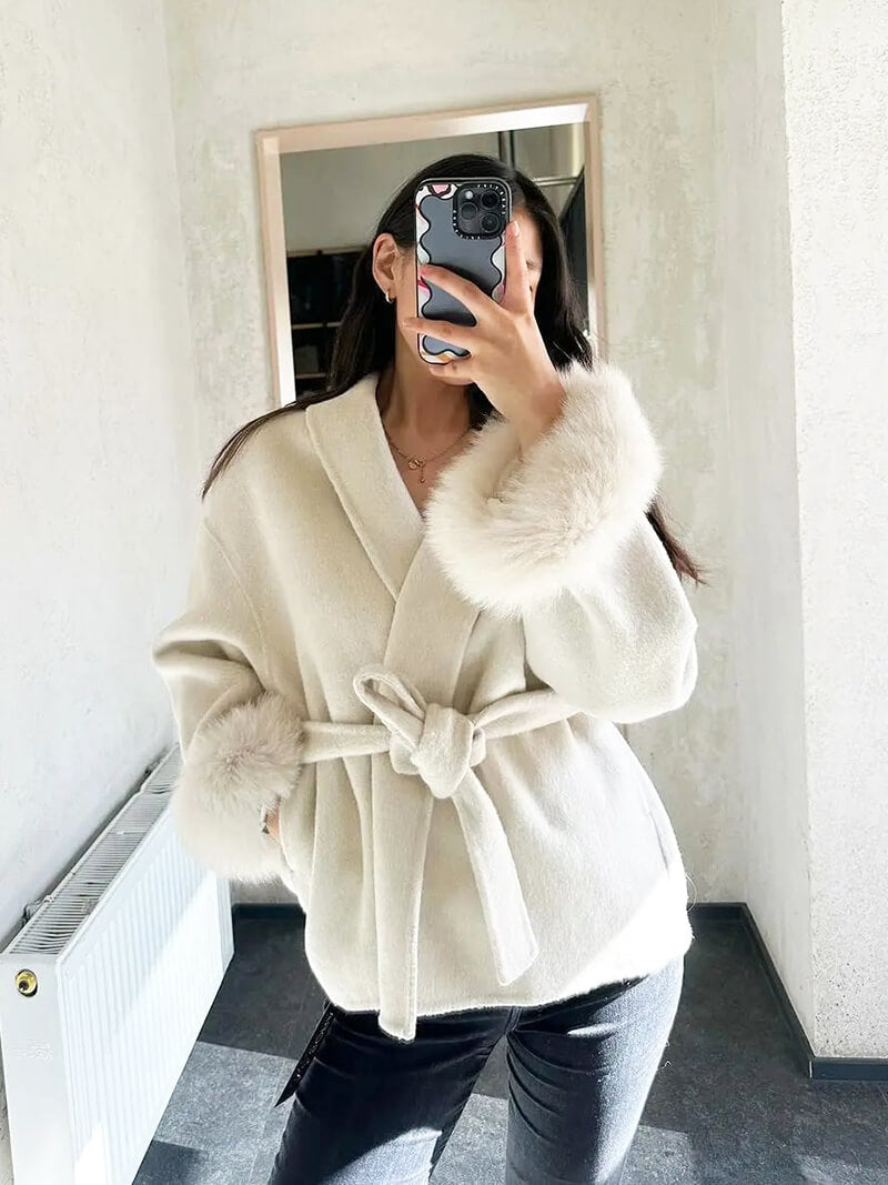 Women's luxury winter coat, an elegant wrap style with a tie waist and exquisite faux fur cuffs.