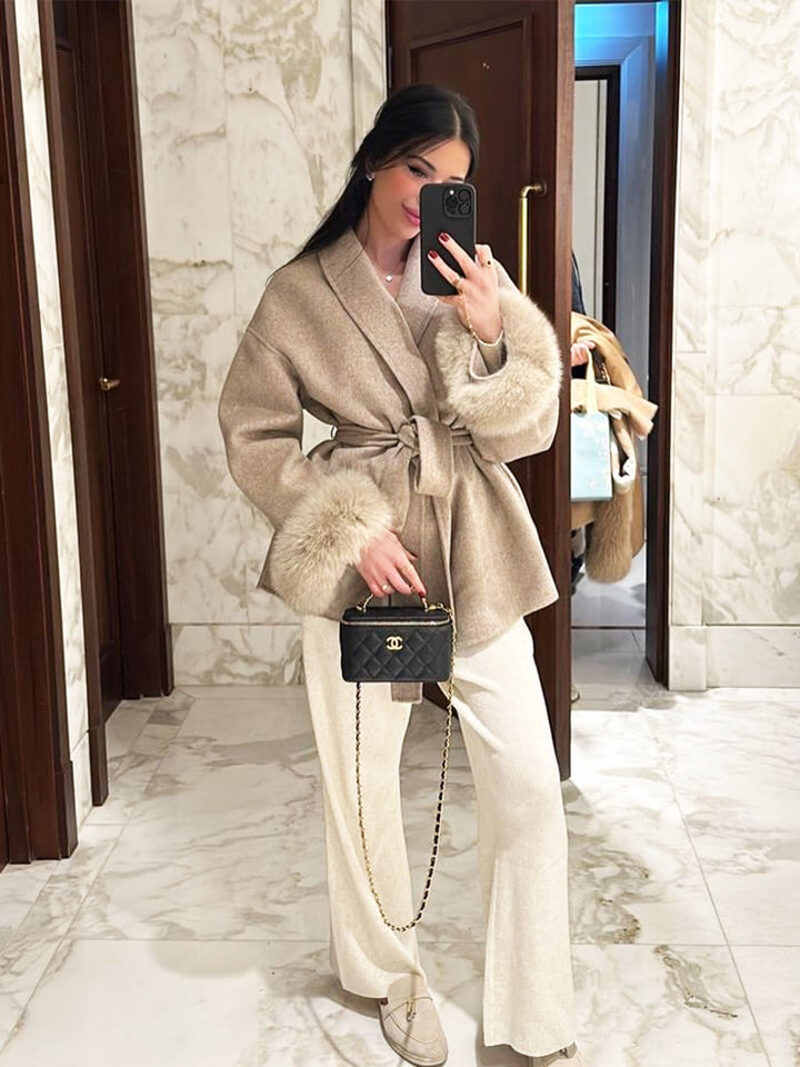 Luxury women's fashion coat: elegant belted wrap design with beautiful faux fur cuffs.