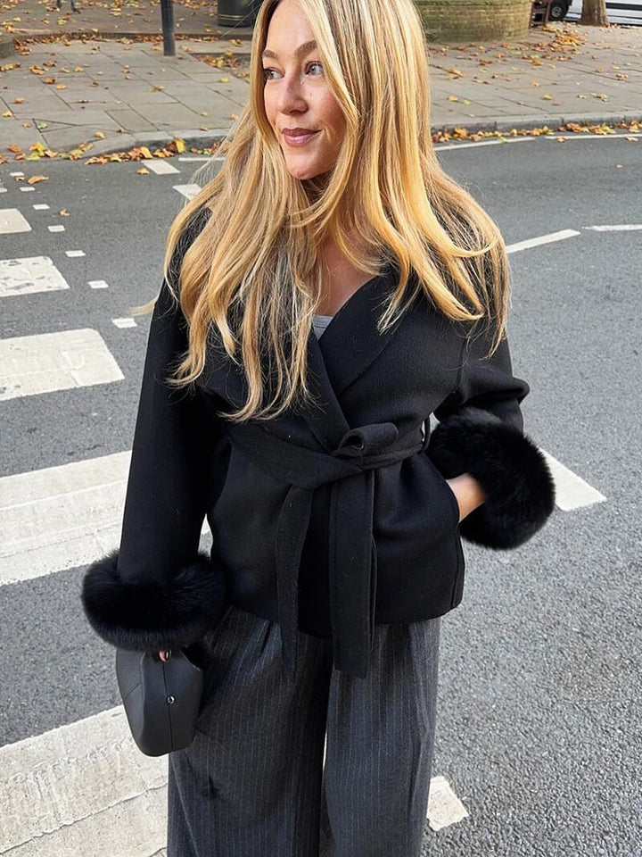 Women's chic winter coat, a tie-waist wrap design with luxurious faux fur cuffs.