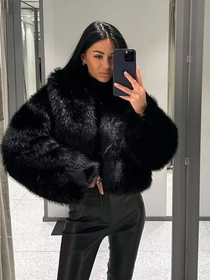 Sophisticated women's winter coat in a classic wide lapel style, perfect for elegant cold-weather looks.