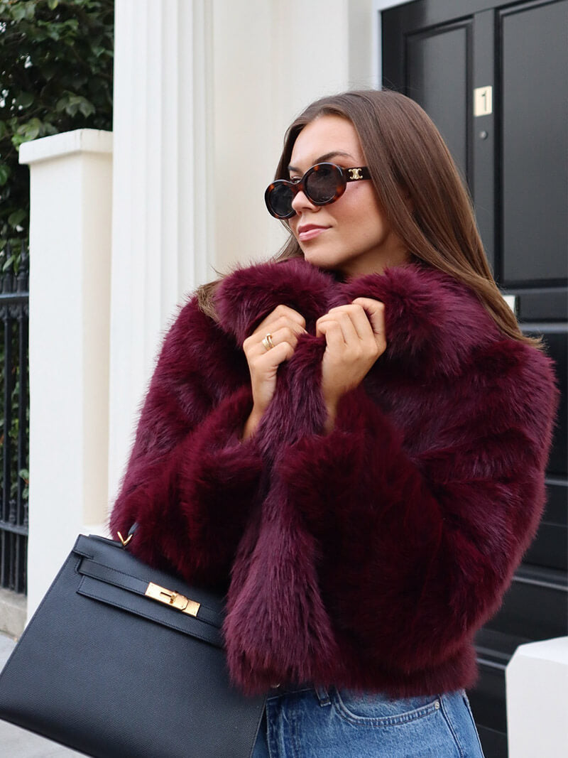 Cruelty-free women's wide lapel winter coat, combining ethical fashion with classic elegance and warmth.