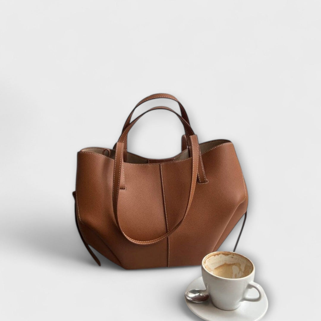 Women's elegant vintage leather tote bag, a durable and stylish daily shoulder handbag accessory.