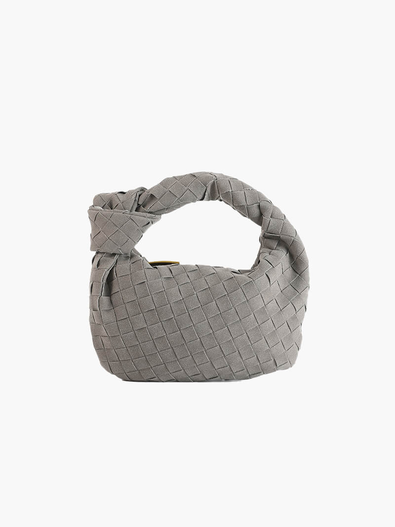 Women's fashion accessory: a luxurious braided suede mini handbag.