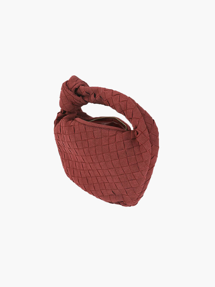 Braided suede mini bag, an elegant everyday accessory for modern women.