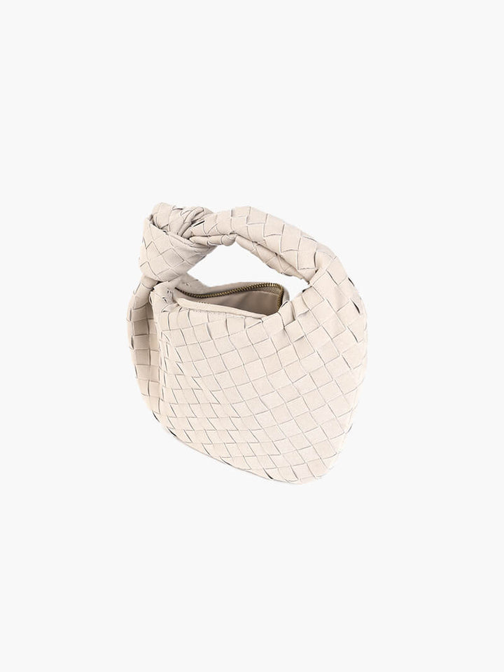 Compact and elegant women's suede mini bag with distinct braiding.