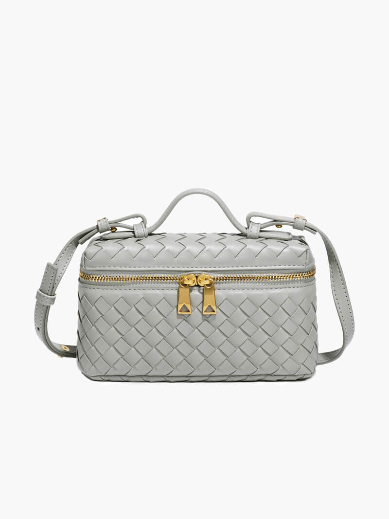 Minimal style women's woven purse, a compact and elegant shoulder bag with gold details.