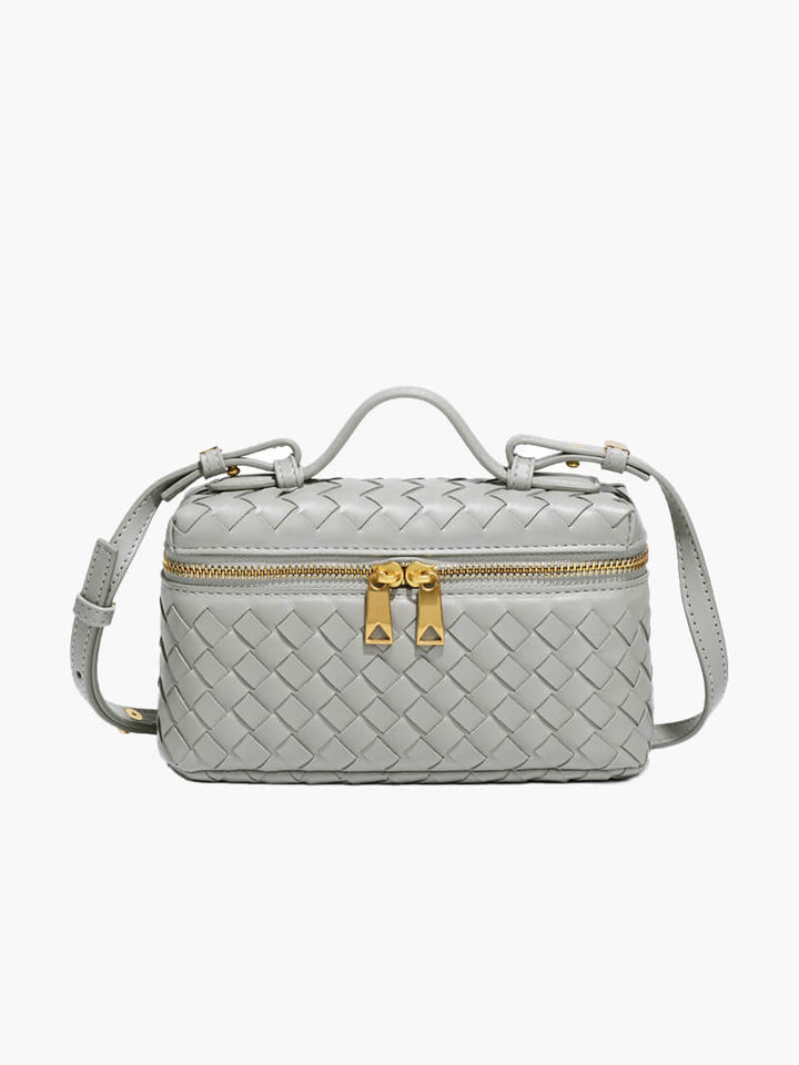 Minimal style women's woven purse, a compact and elegant shoulder bag with gold details.