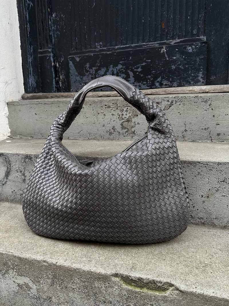 A classic elegant woven shoulder bag for women, made from luxurious vegan leather for daily use.