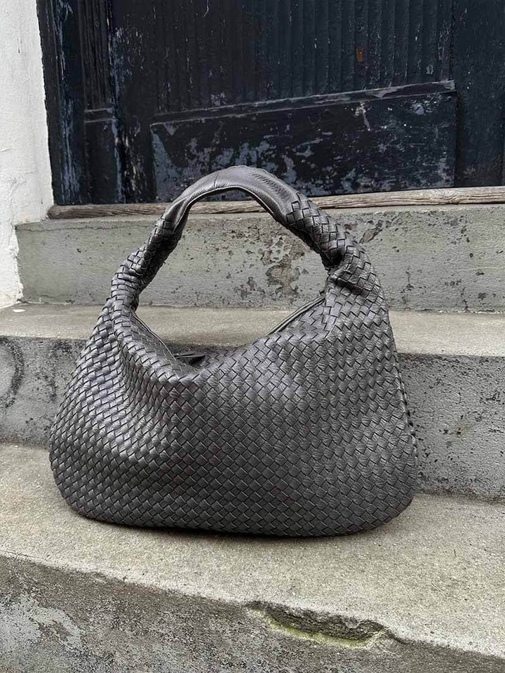 A classic elegant woven shoulder bag for women, made from luxurious vegan leather for daily use.