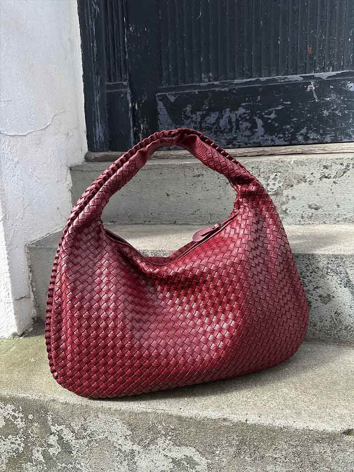 High-quality vegan leather woven handbag, an elegant and spacious shoulder bag for women.