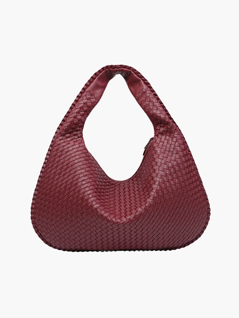 Chic women's handbag with elegant woven details, a spacious shoulder bag for fashion-forward style.