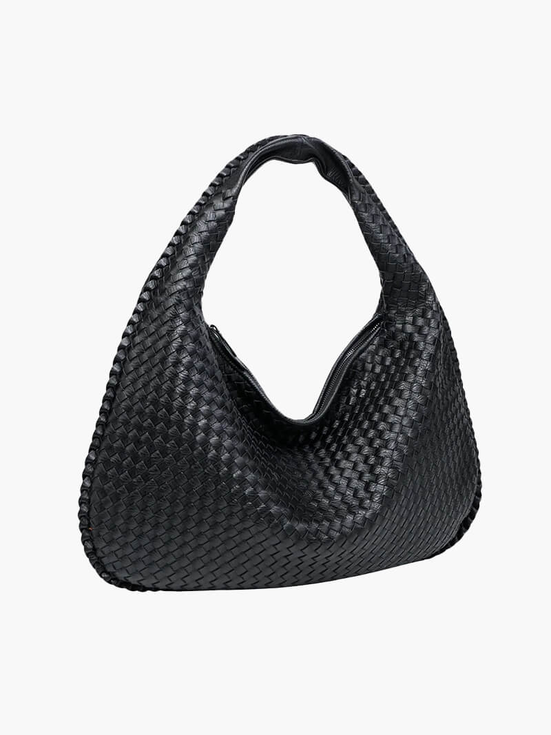 Close-up of the woven texture on this elegant women's vegan leather shoulder handbag.