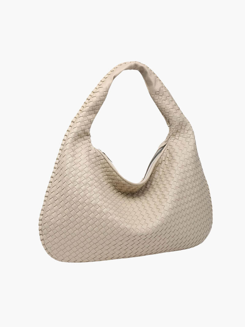 Sophisticated women's woven handbag, a spacious and chic vegan leather shoulder bag for daily wear.