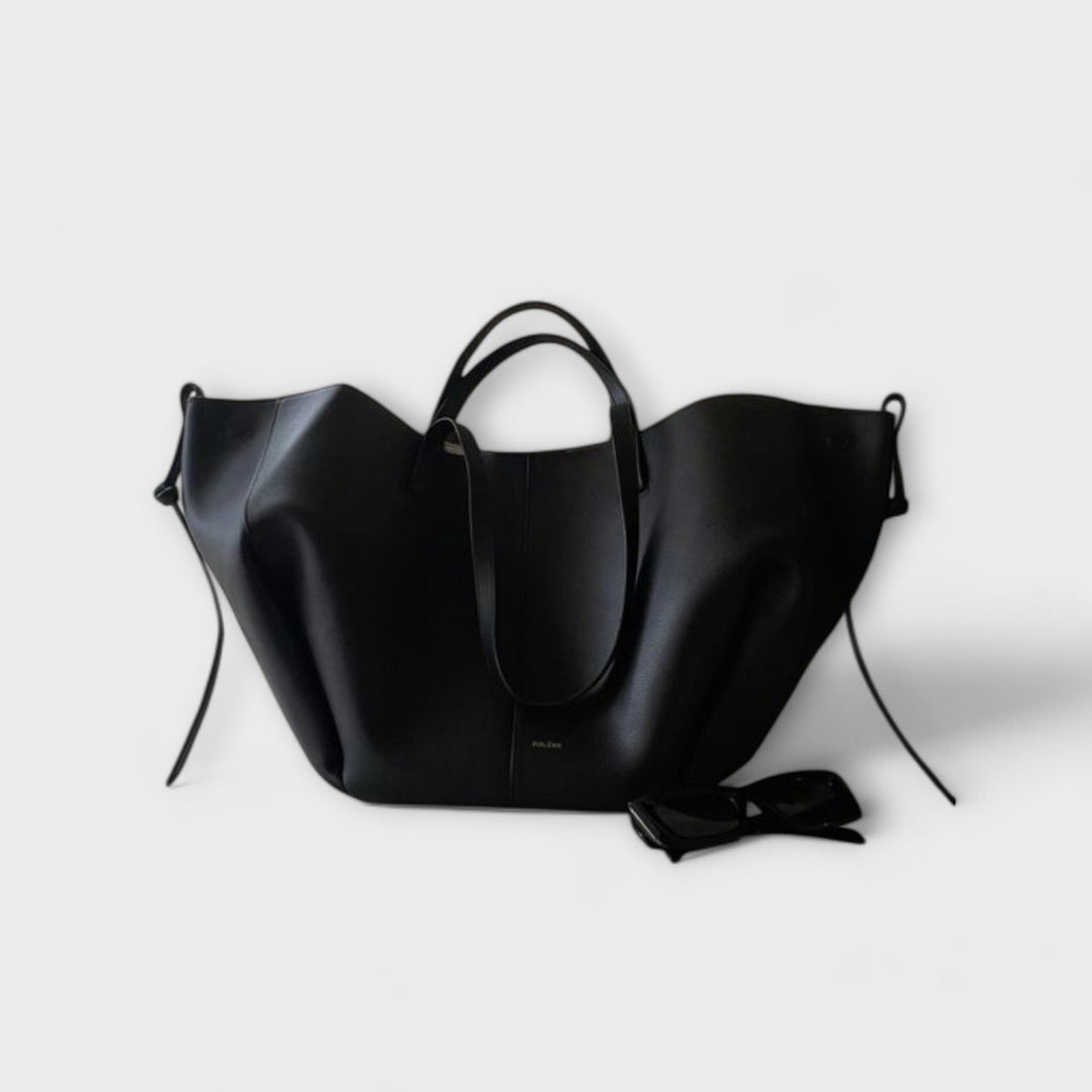 Close-up of elegant vintage leather tote bag texture, highlighting quality for women's daily handbag.