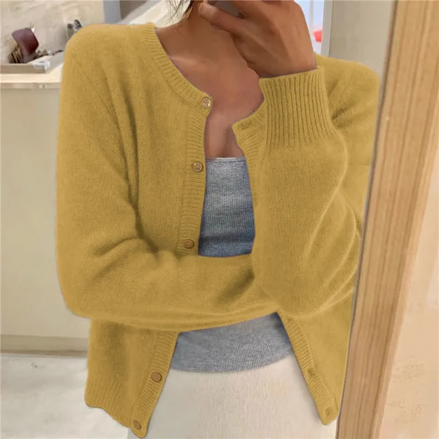 Stylish women's fluffy cardigan. Round neck, button front, ideal for cozy fall/winter comfort and everyday wear.