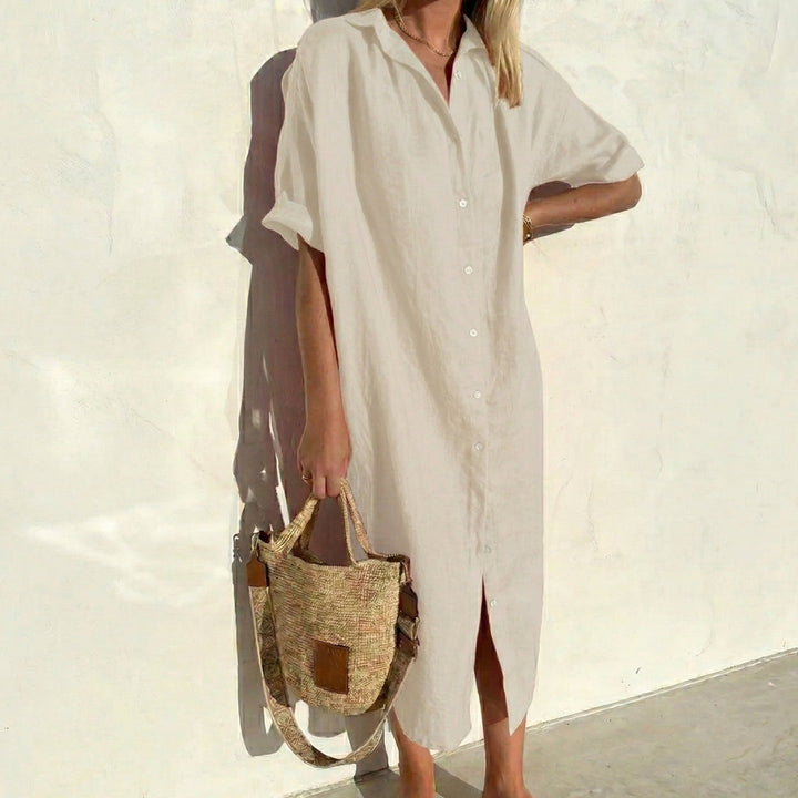 Versatile women's midi shirt dress with oversized, relaxed fit. Short sleeve, button front, ideal casual fashion.