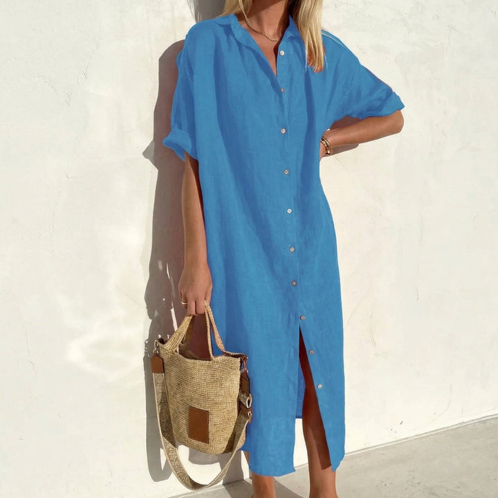 Women's short sleeve oversized midi shirt dress. Relaxed fit, button front detail, ideal casual fashion.