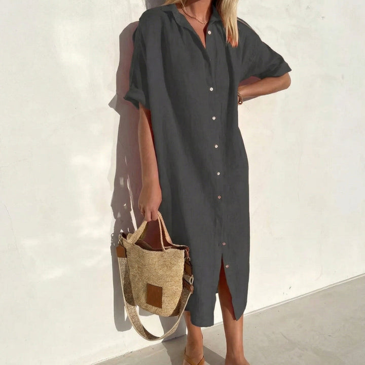 Stylish oversized midi shirt dress for women. Short sleeve and relaxed fit, great for a chic casual look.