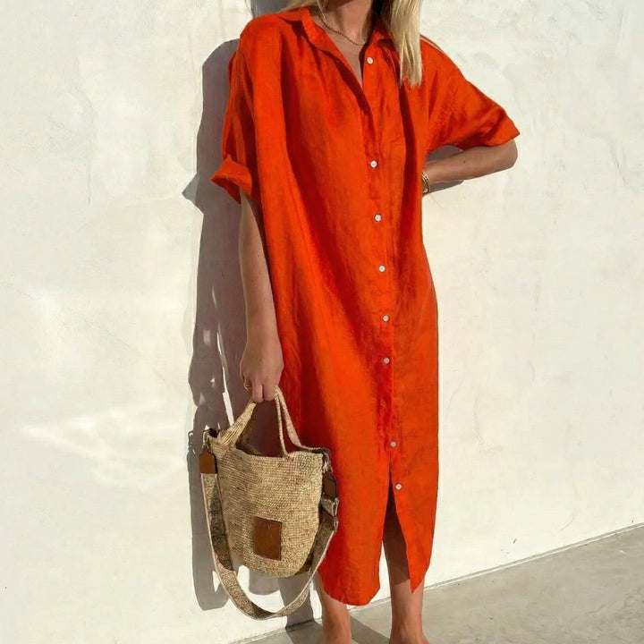 Women's oversized midi shirt dress with relaxed fit and short sleeves, perfect for casual, comfortable style.