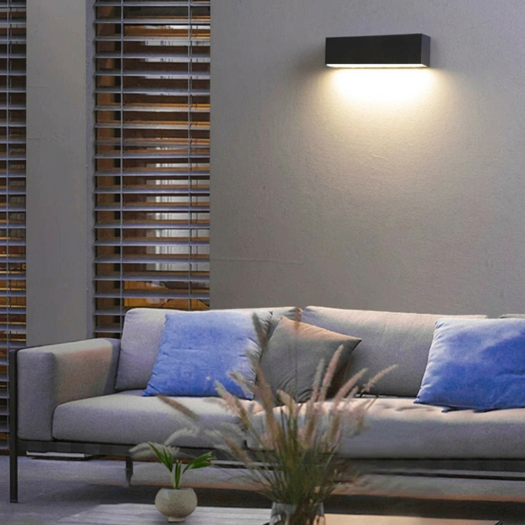 Modern solar LED outdoor wall light providing bright, energy-saving garden & pathway illumination.