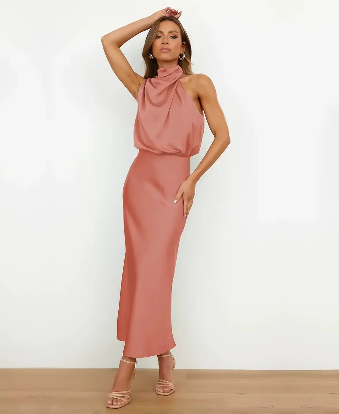Graceful sleeveless high-waist midi dress, essential elegant women's party wear.