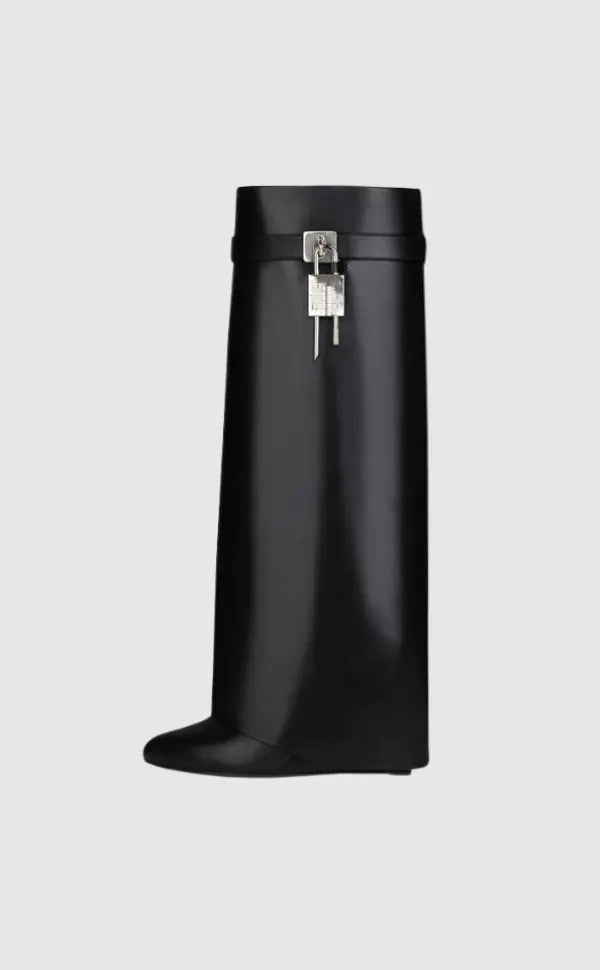 Elegant avant-garde women's tall boots with a shiny finish and unique sculptural wedge.