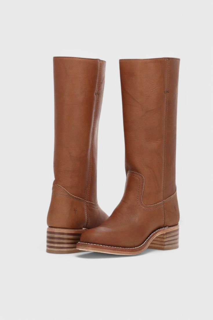 Stylish women's slip-on knee-high boots, featuring a comfortable heel for all-day wear.