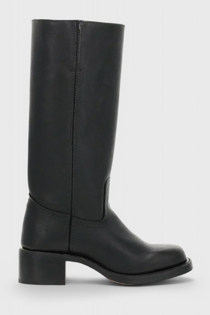 Ladies' knee-high slip-on boots with a stylish heel, designed for comfort and modern elegance.