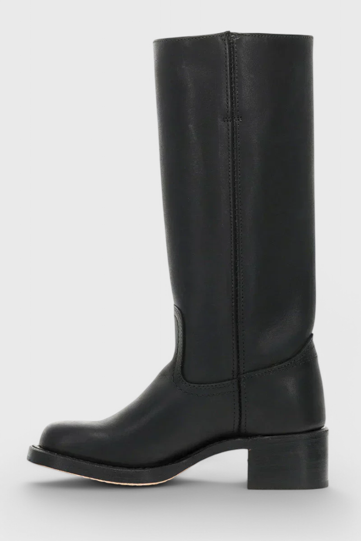 Classic dress boots for women, knee-high and heeled, perfect for office or special occasions.