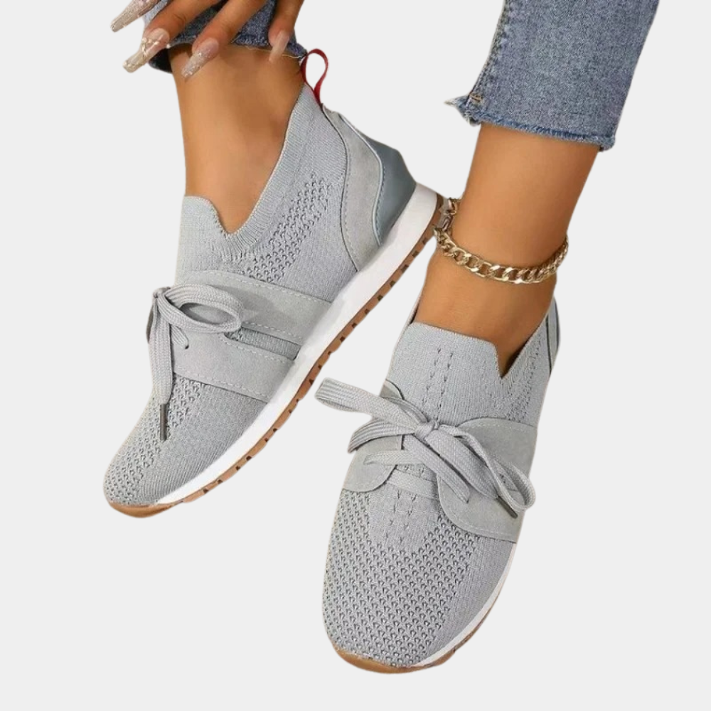 Grey women's orthopedic lace-up sneakers for comfortable walking. Stylish & supportive everyday footwear.