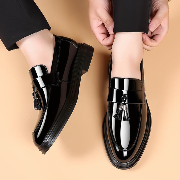 Classic men's polished leather tassel loafers. Versatile slip-on dress shoes for formal or smart casual wear.