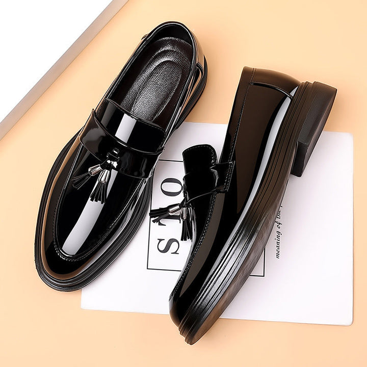 Elegant men's polished tassel penny loafers. Comfortable all-season slip-on shoes for business & formal style.
