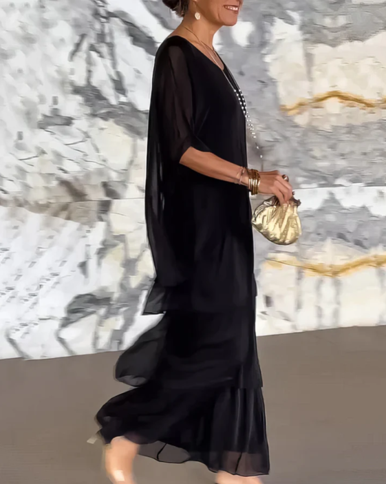 Elegant women's long sleeve maxi dress with unique tiered detailing, offering a comfortable and stylish fit.