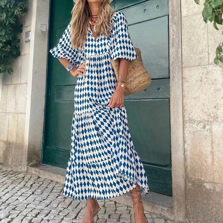 Chic women's blue boho maxi dress with elegant puff sleeves & V-neck. A flowy holiday dress for versatile summer fashion.