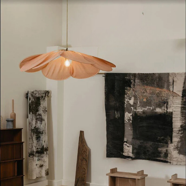 Elegant flower pendant light installed in a dining room, providing warm and atmospheric lighting with natural design.