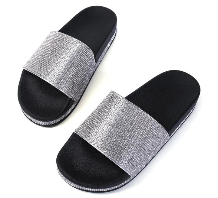 Glamorous women's slides with intricate crystal embellishments, chic summer footwear.