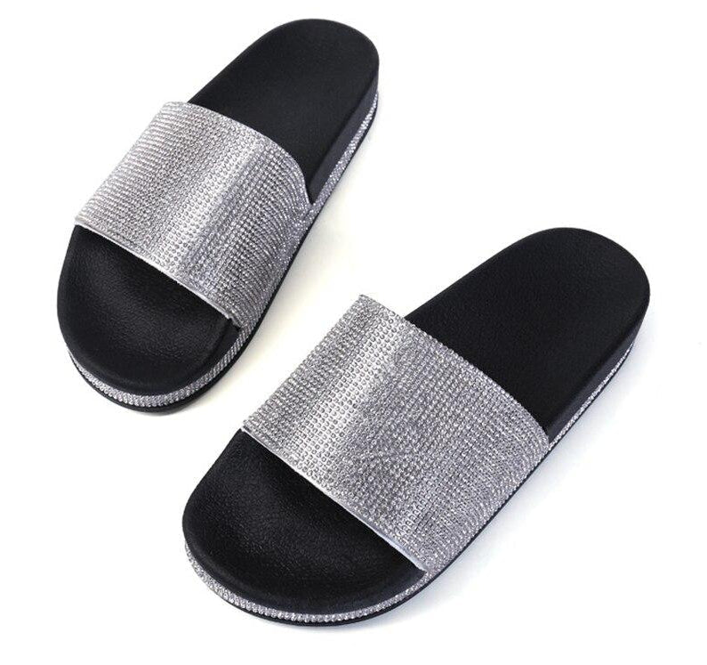 Elegant women's slides, crystal embellished for a chic summer look.