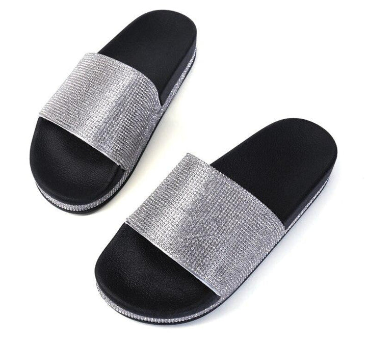 Elegant women's slides, crystal embellished for a chic summer look.