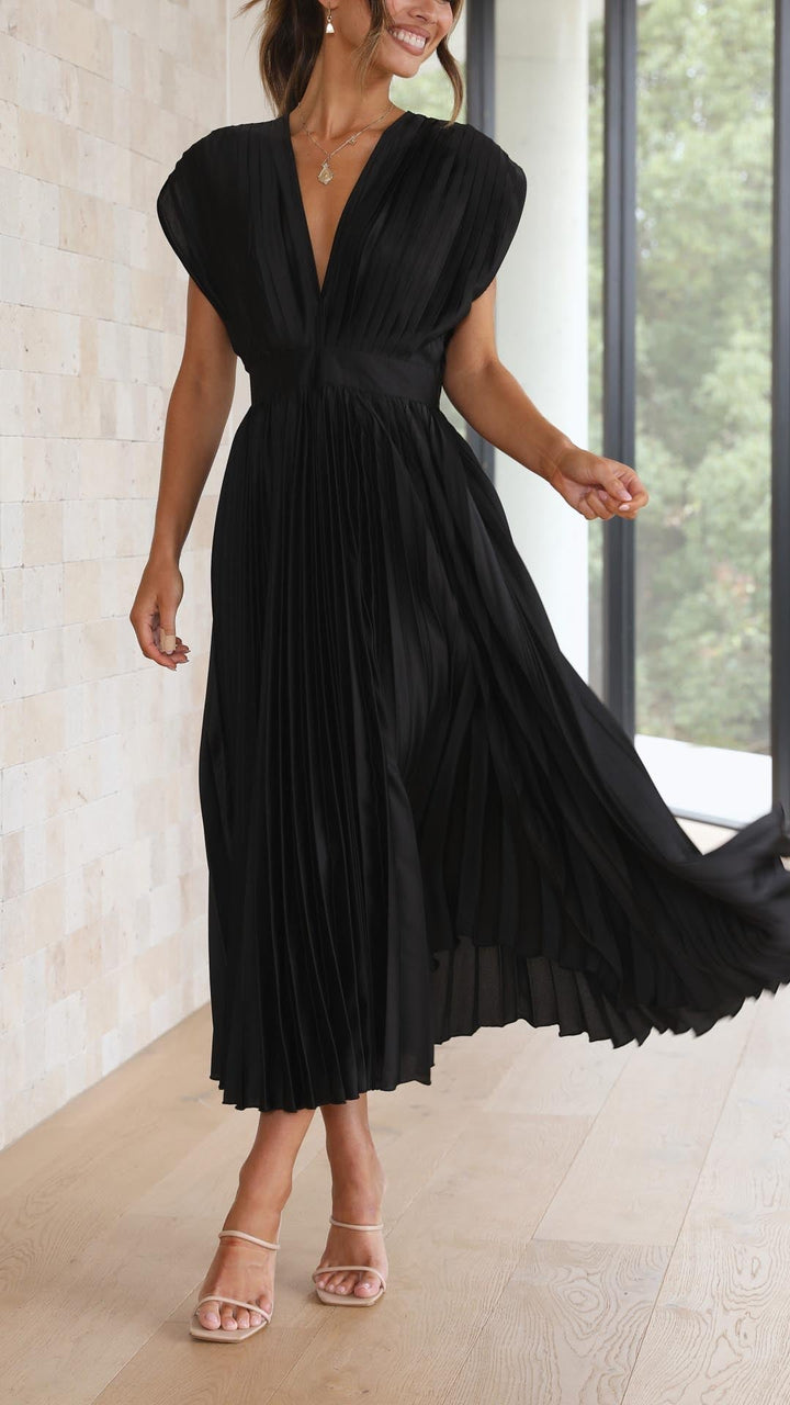 Versatile pleated maxi dress for women, elegant flowing chic fashion.