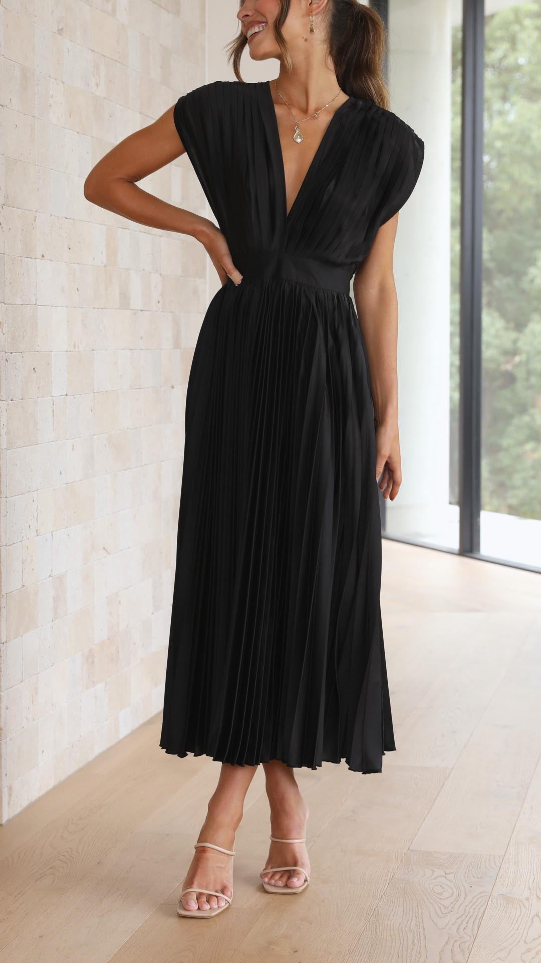 Chic women's long pleated dress, perfect elegant evening or daytime style.