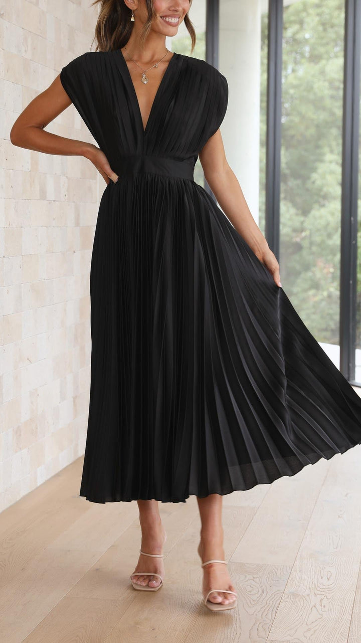 Timeless elegant women's maxi dress, flowing pleated design, chic fashion.