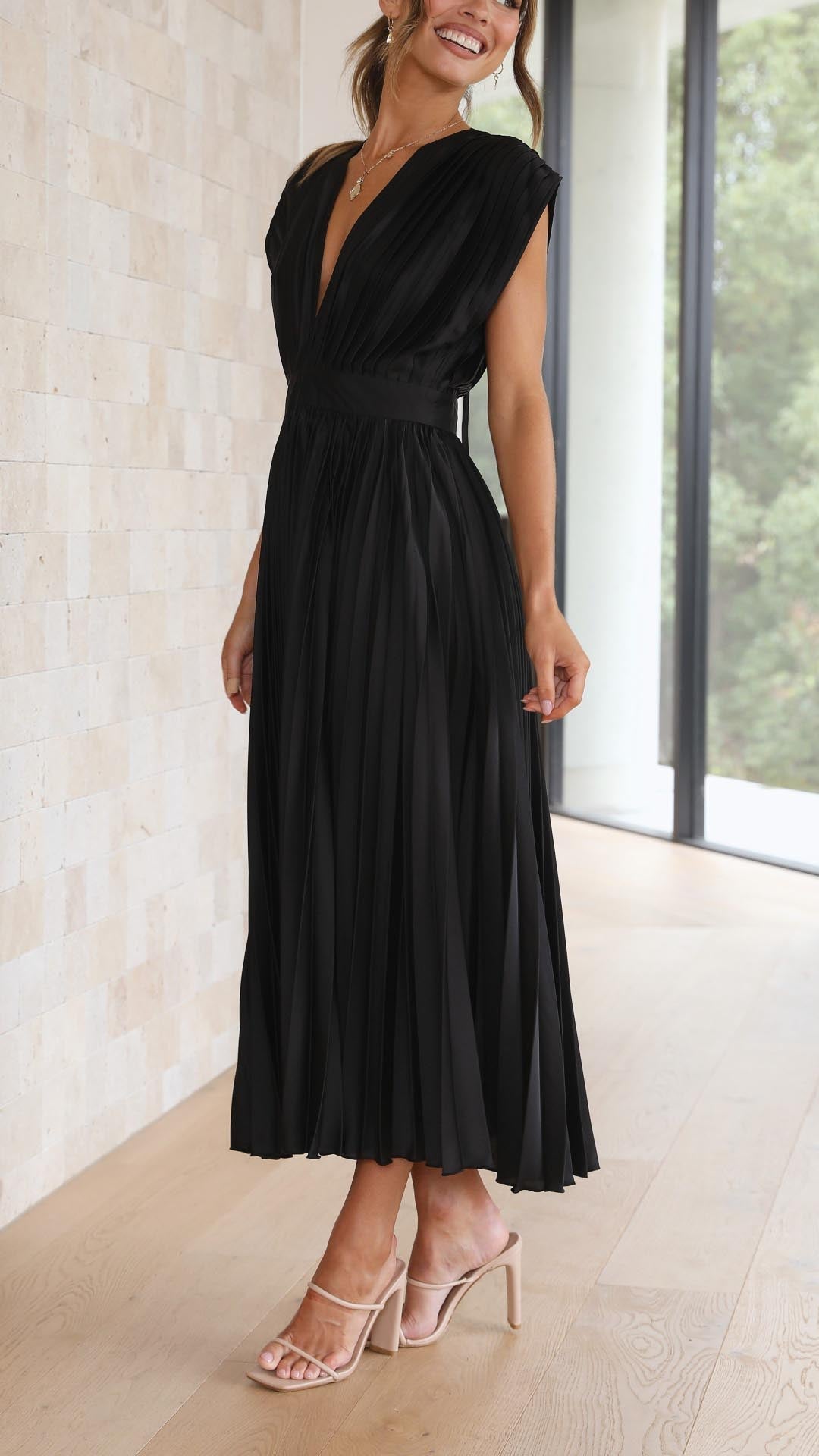 Women's formal evening pleated maxi dress, elegant and stylish apparel.