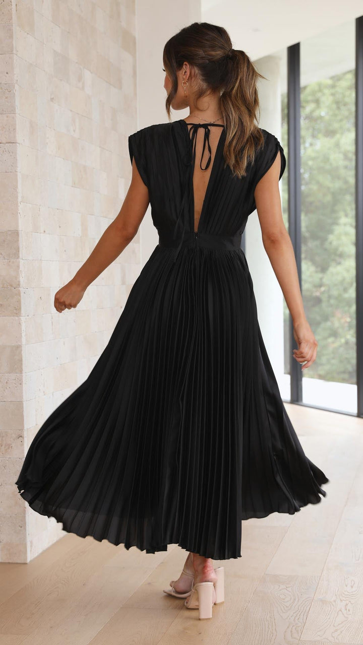 Chic women's flowing pleated maxi dress, timeless elegant style.