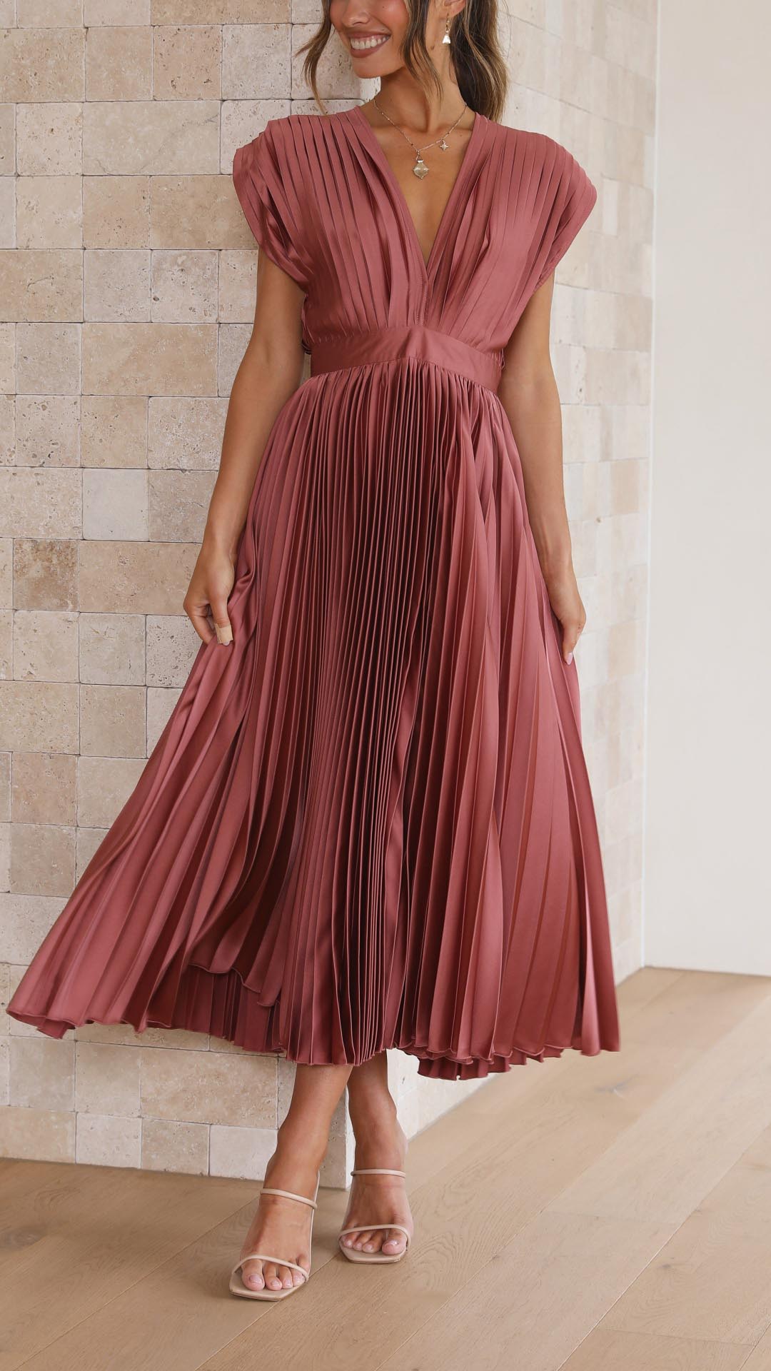 Flowing pleated maxi dress, elegant women's apparel for timeless style.
