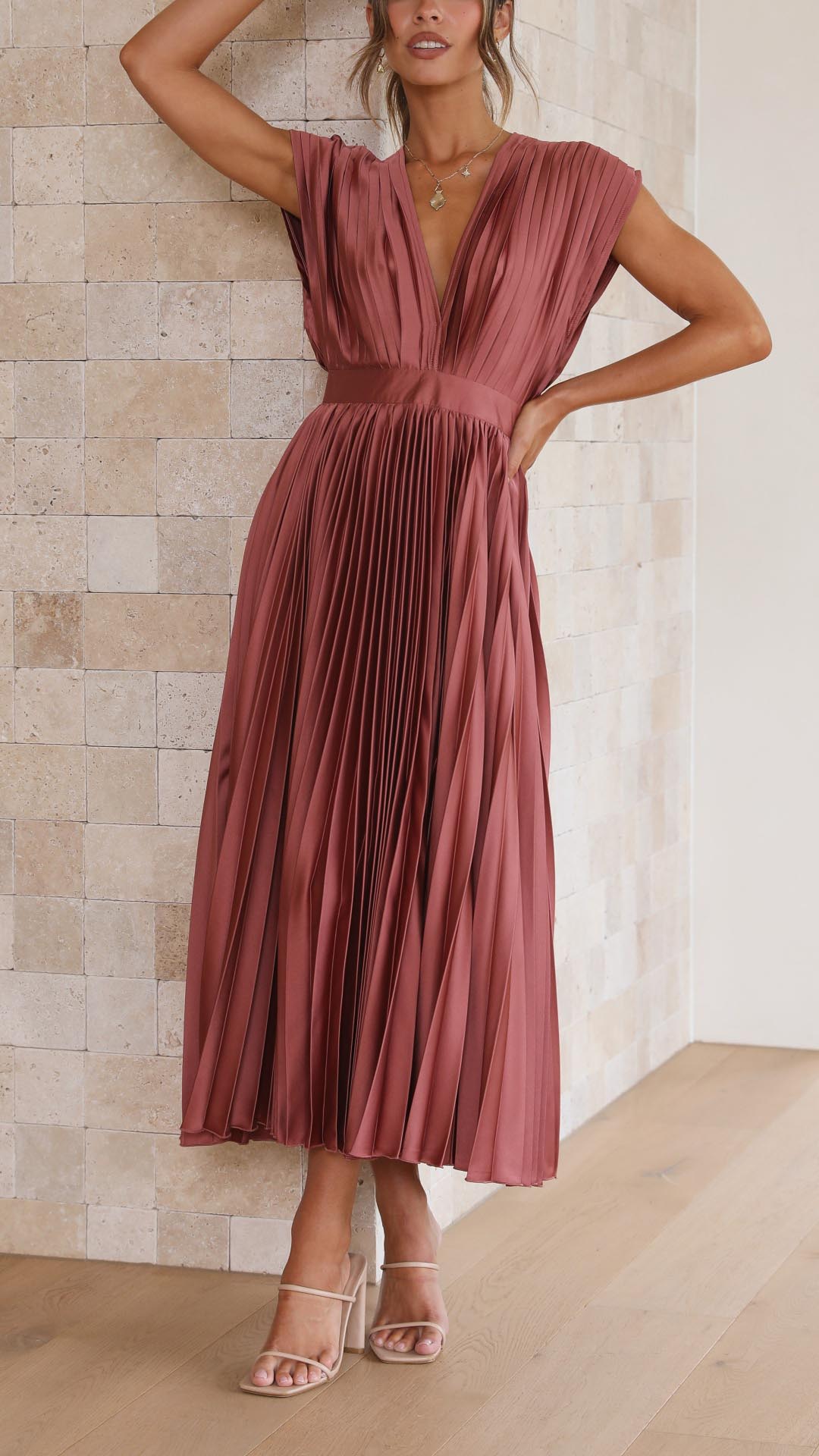 Chic women's pleated long dress, versatile for formal or daytime events.