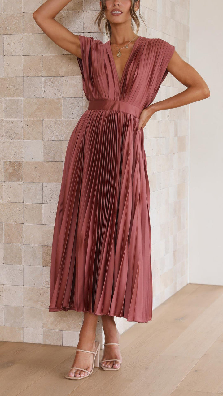 Chic women's pleated long dress, versatile for formal or daytime events.