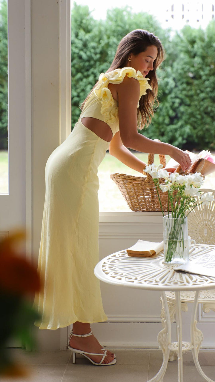 Sophisticated women's yellow one-shoulder maxi dress, elegant cutout & frill, perfect formal wear.