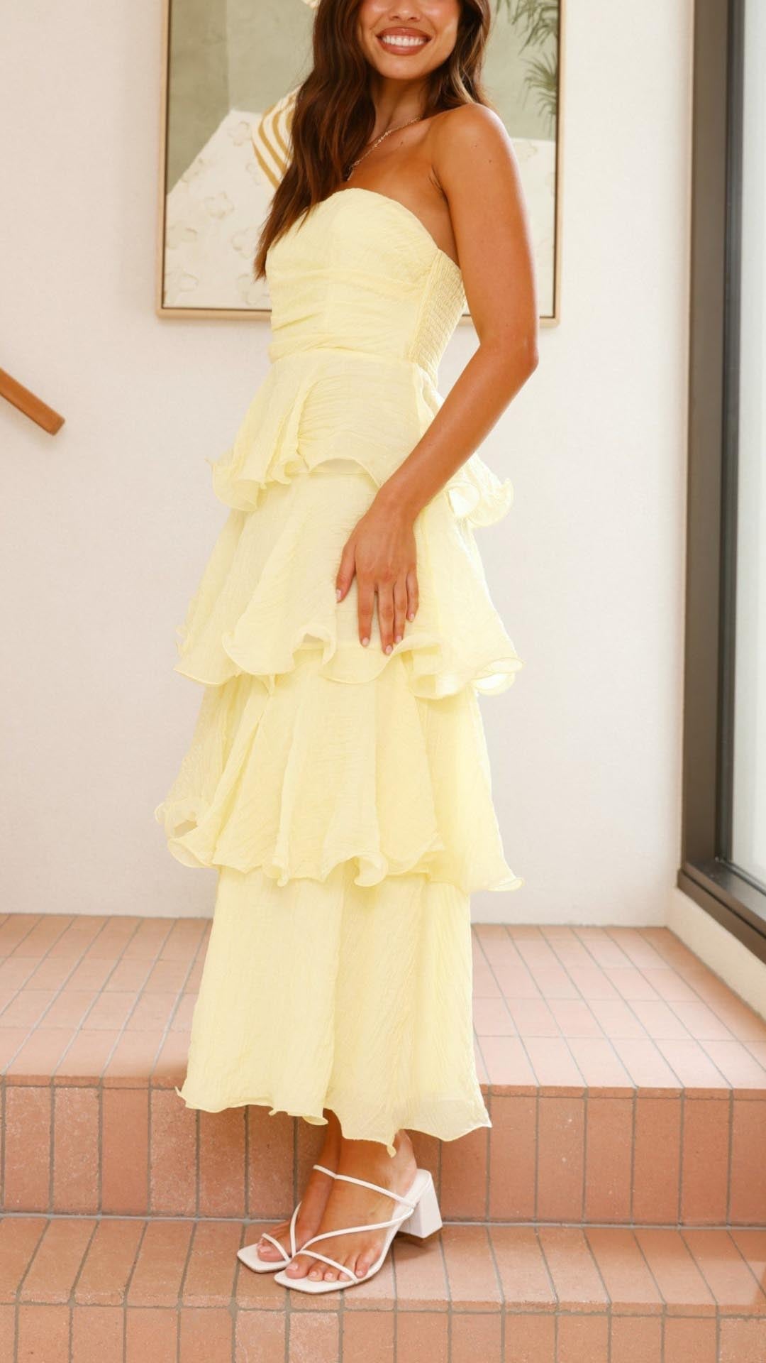 Strapless tiered ruffle maxi dress for women, ideal as a wedding guest or evening gown.