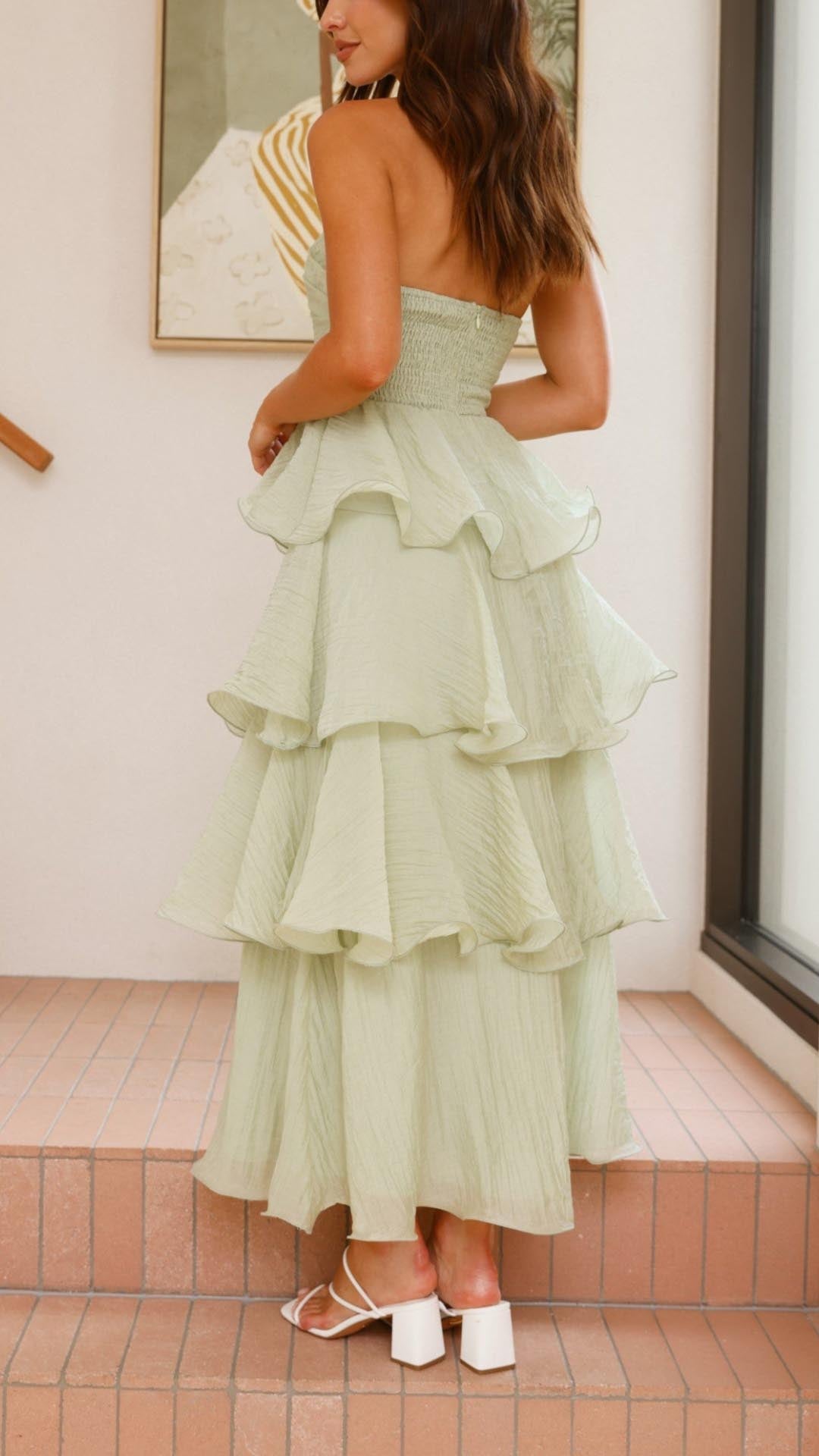 Sophisticated women's strapless tiered ruffle maxi dress, an elegant choice for formal events.